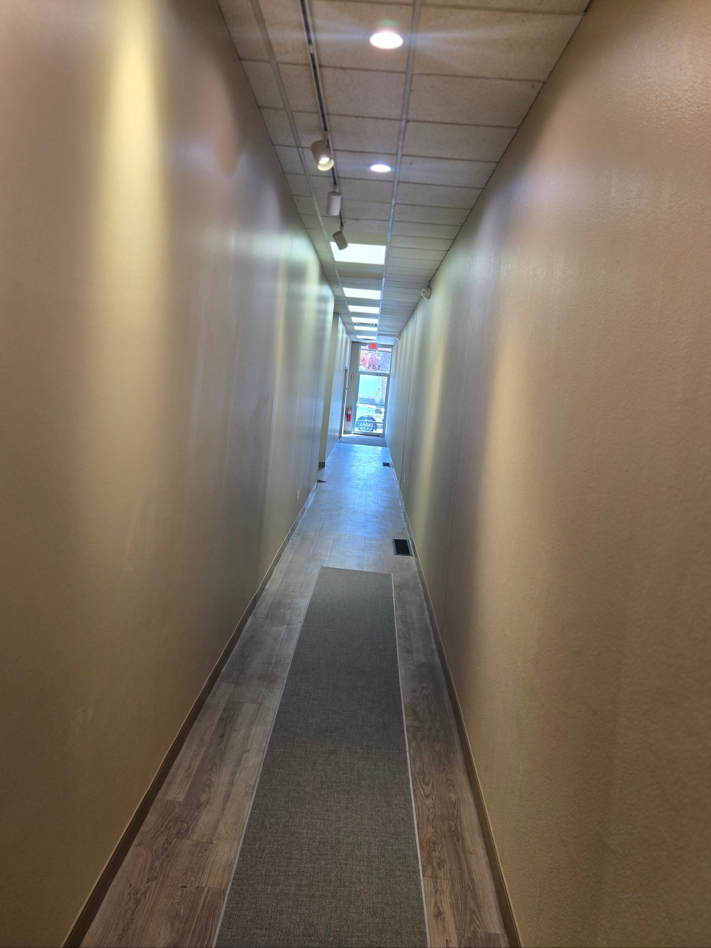 Marketplace Hall A Long Gallery with Focused Lighting To Display Artist's Work.