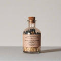 Literary Apothecary Match Bottle with Quote Label: "Fire that's kept closest burns most of all." - William Shakespeare