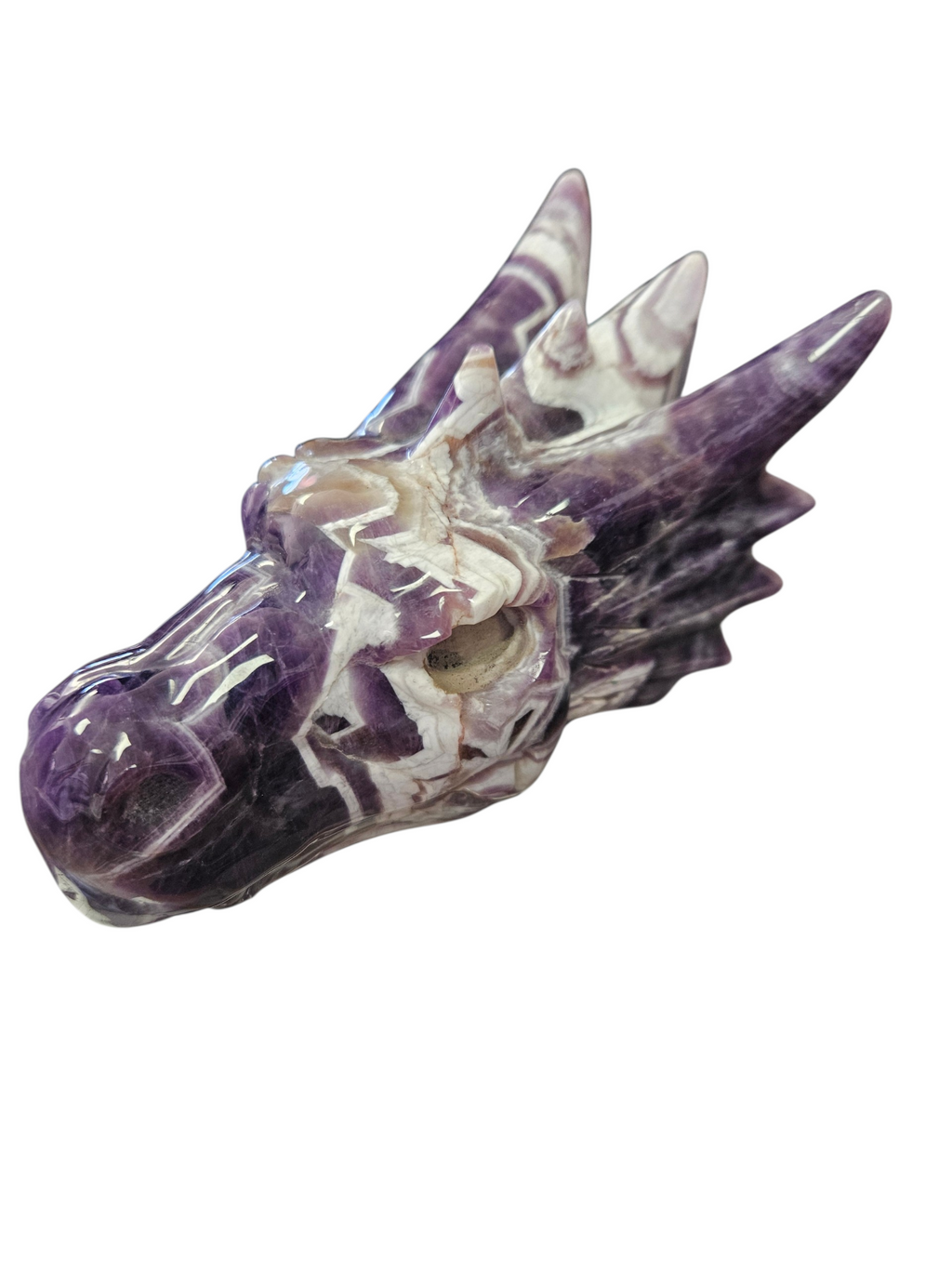 Hand-carved from a solid 1.22lb block of Dream Chevron Amethyst, this statement piece is a masterclass in nature's artistry.