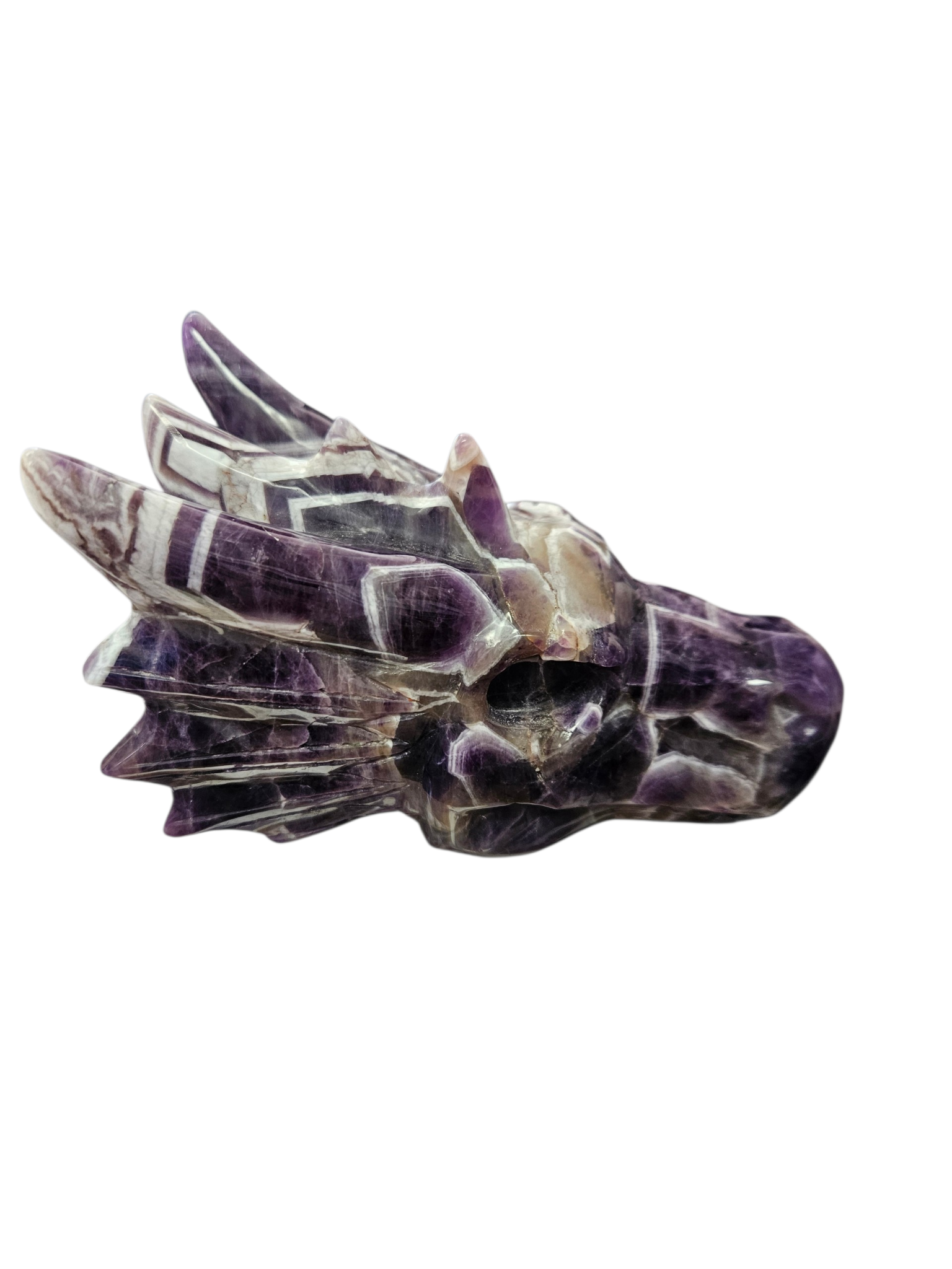 Hand-carved from a solid 1.22lb block of Dream Chevron Amethyst, this statement piece is a masterclass in nature's artistry.